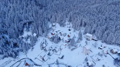 an aerial view of a small village covered in snow at KopanikSkiRooms15E in Kopaonik