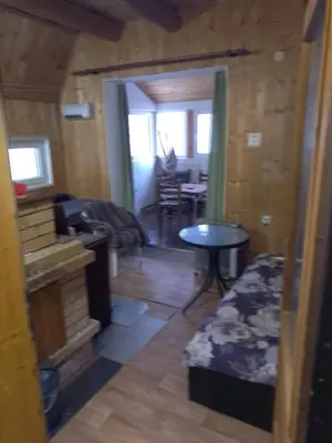 a living room with a table and a dining room at KopanikSkiRooms15E in Kopaonik