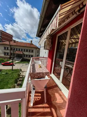 a table on the porch of a building at Apartmani MiS apartman br 2 in Soko Banja