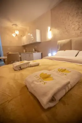 a bedroom with two beds with towels on them at Lotos Apartments in Kruševac