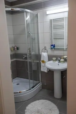 a bathroom with a shower and a sink at Lotos Apartments in Kruševac
