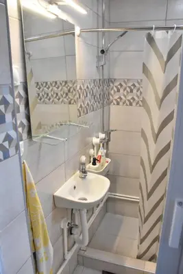 a bathroom with a sink and a shower at BeLux apartment in Niš
