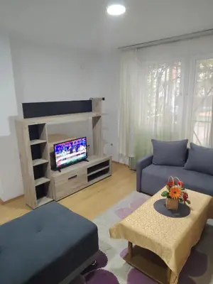 a living room with a couch and a tv at Fili 1 in Ćuprija