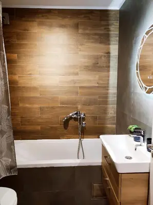 a bathroom with a tub and a sink at Riverside LUX Apartment in Pirot