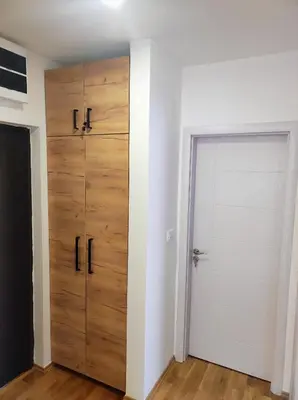 a room with a closet and a door at Riverside LUX Apartment in Pirot