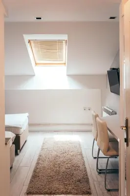 a bedroom with a bed and a window at Hotel Dijana in Pirot