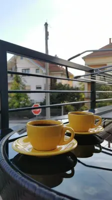 two cups of coffee sitting on top of a table at SokoStar Lux in Soko Banja