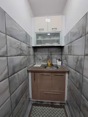 a kitchen with a sink and a microwave at Apartman Arsić Zajecar in Zaječar
