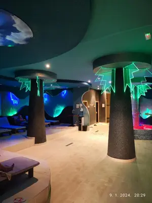 a room with two trees with green lights on it at Castello apartman Kopaonik Kraljevi Cardaci komplex in Kopaonik