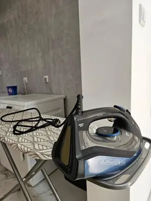 a iron sitting on top of a table at Nikolic Apartment in Leskovac