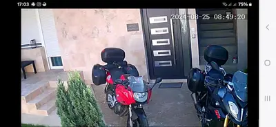 two motorcycles parked in front of a building at Nikolic Apartment in Leskovac