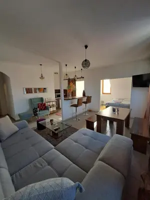 a living room with a couch and a table at Sofi II in Niš