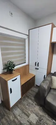 a living room with a couch and a window at Marinkovic 2 stan na dan in Vranje
