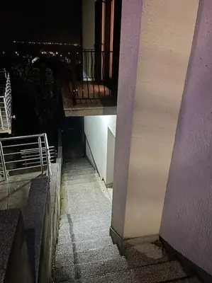 a view of a balcony of a building at night at Jordan Apartman in Niška Banja