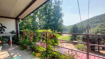 a balcony with a view of a mountain at Krčma u Planini in Bojnik