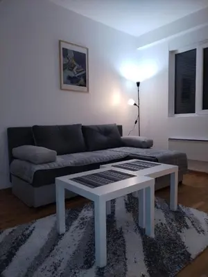 a living room with a couch and a coffee table at S&B Apartman Vrnjačka Banja in Vrnjačka Banja