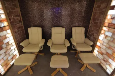 a group of chairs and chairs in a room at Orbis Design Hotel & Spa in Paraćin