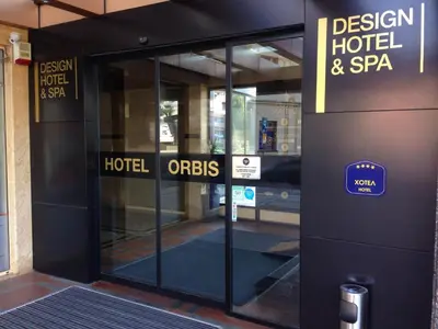 an open door to a hotel and spa building at Orbis Design Hotel & Spa in Paraćin