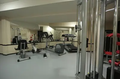 a gym with several exercise equipment in a room at Orbis Design Hotel & Spa in Paraćin