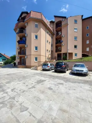 a group of cars parked in front of a building at NENADOVO in Soko Banja