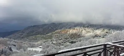 a view of a mountain with clouds in the sky at TopView Milmari N87 in Kopaonik