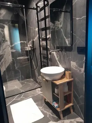 a bathroom with a sink and a shower at Stefany in Kopaonik