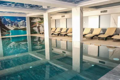 a conference room with a pool in the middle of the floor at Apartman Košuta-Prezident in Kopaonik