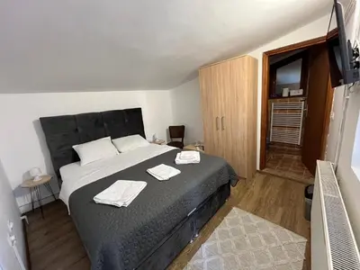 a bedroom with a bed with two towels on it at 9 mezeta in Pirot