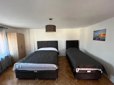 a bedroom with two beds in a room at 9 mezeta in Pirot