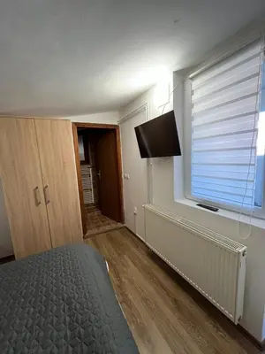 a bedroom with a bed and a window at 9 mezeta in Pirot