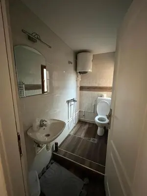 a bathroom with a sink and a toilet at 9 mezeta in Pirot