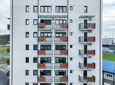 an apartment building with balconies on the side of it at Boho style in Jagodina