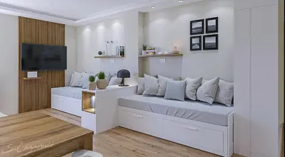 a living room with a bed with a tv on it at Frosty Peaks Apartment in Kopaonik