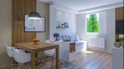 a dining room with a table and chairs and a window at Frosty Peaks Apartment in Kopaonik