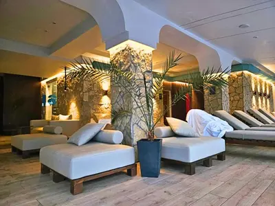 a lobby with couches and chairs in a room at Ibis Lux Milmari Apartman N51 Kopaonik Panorama Spa in Kopaonik