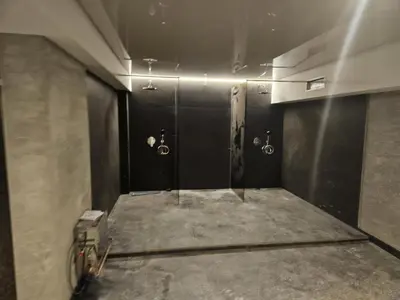 a bathroom with two urinals on the walls of a room at Harmony, Residence Hill A85 in Kopaonik
