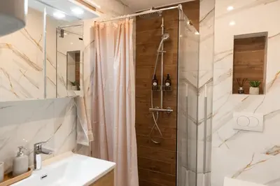 a bathroom with a shower and a sink at Glečer Kop, Apartment A14, FREE Parking Garage in Kopaonik