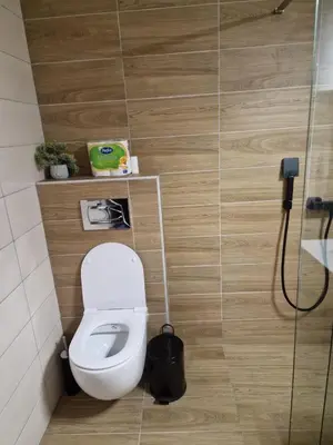 a bathroom with a toilet and a shower at Apartman 318 - Sunčana Planina in Kopaonik