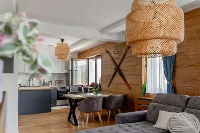 a living room with a couch and a table at Apartman Rustic 85m2 in Kopaonik