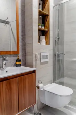 a bathroom with a toilet and a sink and a shower at Apartman Rustic 85m2 in Kopaonik