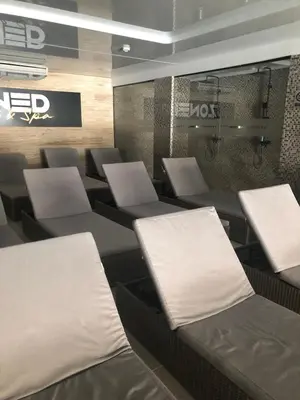 a room with rows of chairs and tables in a store at Kop apartman I01 in Kopaonik