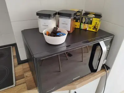 a black table with a bowl on top of it at Home apartment in Niš