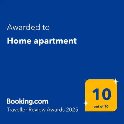 a yellow sign that says awarded to home apartment at Home apartment in Niš