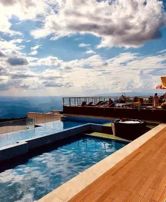 a swimming pool on top of a building at Apartman Adut Kop. in Kopaonik