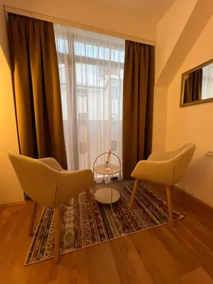 two chairs and a table in front of a window at Studio M in Kopaonik