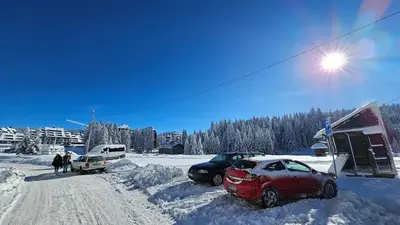 a group of cars parked in the snow at Silver Pine Kopaonik in Kopaonik
