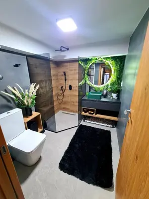 a bathroom with a toilet and a sink with a mirror at Drop Kop in Brzeće