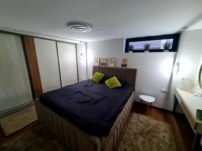 a bedroom with a bed with two yellow pillows on it at Drop Kop in Brzeće