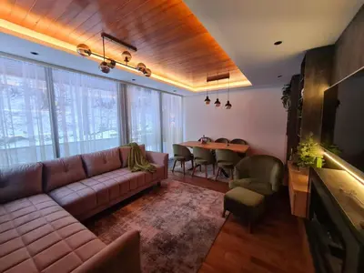 a living room with a couch and a table at Drop Kop in Brzeće