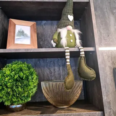a stuffed animal sitting on a shelf next to a plant at Drop Kop in Brzeće